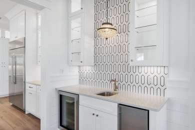 This thoughtfully designed expanded Coral Bean plan by Huff on Origins Golf Club in Florida - for sale on GolfHomes.com, golf home, golf lot