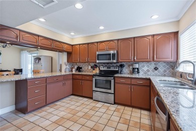Welcome to this beautifully maintained 3-bedroom, 2-bath home on The Grand Club - Pine Lakes Course in Florida - for sale on GolfHomes.com, golf home, golf lot