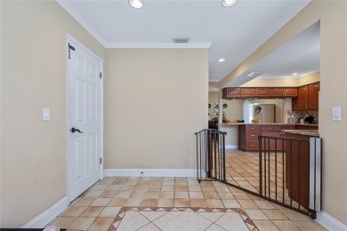 Welcome to this beautifully maintained 3-bedroom, 2-bath home on The Grand Club - Pine Lakes Course in Florida - for sale on GolfHomes.com, golf home, golf lot
