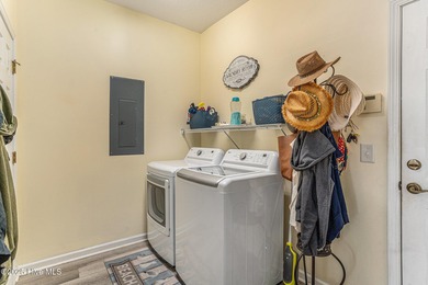 Live where every day feels like vacation! This custom, all brick on Sea Trail Golf Resort in North Carolina - for sale on GolfHomes.com, golf home, golf lot