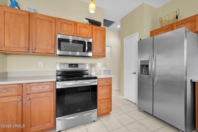 Discover effortless living in this charming Clayton model patio on Okatie Creek Golf Club in South Carolina - for sale on GolfHomes.com, golf home, golf lot