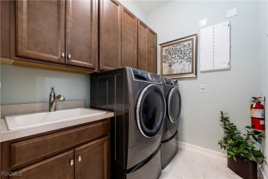 Exquisite Former Model Home in Magnolia Landing! Welcome to this on Herons Glen Golf and Country Club in Florida - for sale on GolfHomes.com, golf home, golf lot