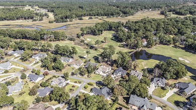 Live where every day feels like vacation! This custom, all brick on Sea Trail Golf Resort in North Carolina - for sale on GolfHomes.com, golf home, golf lot