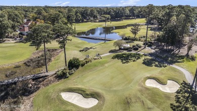 Live where every day feels like vacation! This custom, all brick on Sea Trail Golf Resort in North Carolina - for sale on GolfHomes.com, golf home, golf lot