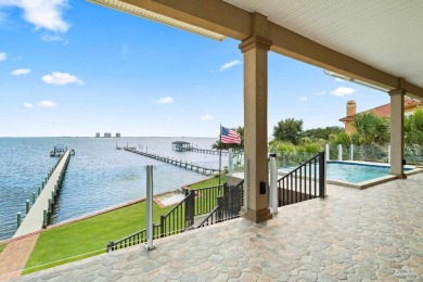 This stunning ICF waterfront home, featuring 135 feet on the on Tiger Point Golf and Country Club in Florida - for sale on GolfHomes.com, golf home, golf lot