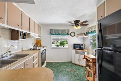 This 2-bedroom, 2-bath furnished mobile home located in the on Bay Tree Golf Course in Florida - for sale on GolfHomes.com, golf home, golf lot