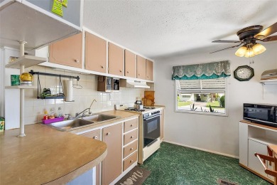 This 2-bedroom, 2-bath furnished mobile home located in the on Bay Tree Golf Course in Florida - for sale on GolfHomes.com, golf home, golf lot