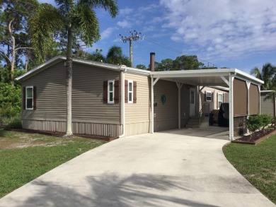 Beautifully updated home which backs to canal and greenbelt on Spanish Lakes I in Florida - for sale on GolfHomes.com, golf home, golf lot