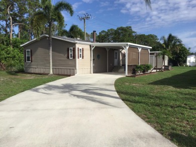 Beautifully updated home which backs to canal and greenbelt on Spanish Lakes I in Florida - for sale on GolfHomes.com, golf home, golf lot