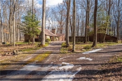 Amazing golf course views from this rustic contemporary home on Nemacolin Woodlands Resort and Spa in Pennsylvania - for sale on GolfHomes.com, golf home, golf lot