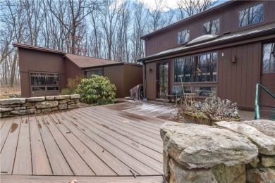 Amazing golf course views from this rustic contemporary home on Nemacolin Woodlands Resort and Spa in Pennsylvania - for sale on GolfHomes.com, golf home, golf lot