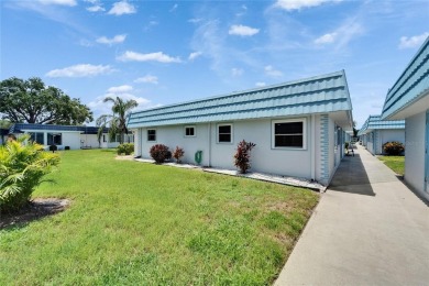 This move-in-ready gem welcomes you with beautiful luxury vinyl on Kings Point Executive Golf Course in Florida - for sale on GolfHomes.com, golf home, golf lot