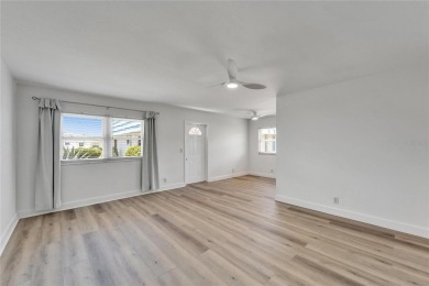 This move-in-ready gem welcomes you with beautiful luxury vinyl on Kings Point Executive Golf Course in Florida - for sale on GolfHomes.com, golf home, golf lot