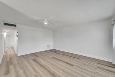 This move-in-ready gem welcomes you with beautiful luxury vinyl on Kings Point Executive Golf Course in Florida - for sale on GolfHomes.com, golf home, golf lot