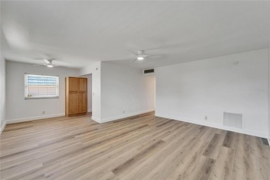 This move-in-ready gem welcomes you with beautiful luxury vinyl on Kings Point Executive Golf Course in Florida - for sale on GolfHomes.com, golf home, golf lot
