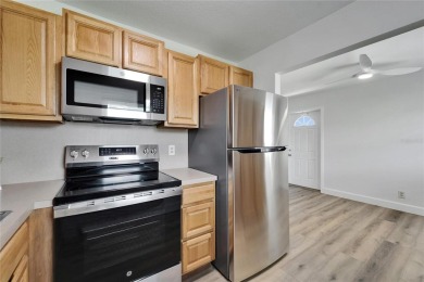 This move-in-ready gem welcomes you with beautiful luxury vinyl on Kings Point Executive Golf Course in Florida - for sale on GolfHomes.com, golf home, golf lot