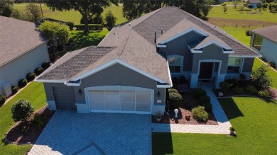Stunning home loaded with upgrades on a deep semi-private lot on Eagle Ridge At Spruce Creek Country Club in Florida - for sale on GolfHomes.com, golf home, golf lot