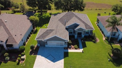 Stunning home loaded with upgrades on a deep semi-private lot on Eagle Ridge At Spruce Creek Country Club in Florida - for sale on GolfHomes.com, golf home, golf lot