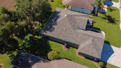 Stunning home loaded with upgrades on a deep semi-private lot on Eagle Ridge At Spruce Creek Country Club in Florida - for sale on GolfHomes.com, golf home, golf lot