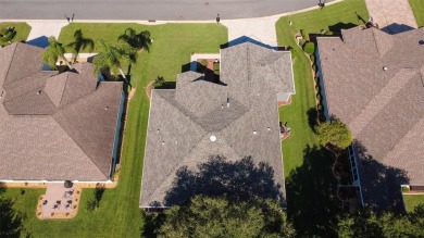Stunning home loaded with upgrades on a deep semi-private lot on Eagle Ridge At Spruce Creek Country Club in Florida - for sale on GolfHomes.com, golf home, golf lot