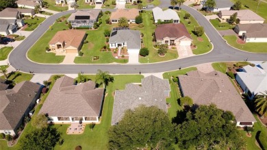 Stunning home loaded with upgrades on a deep semi-private lot on Eagle Ridge At Spruce Creek Country Club in Florida - for sale on GolfHomes.com, golf home, golf lot
