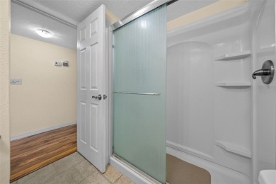 EXQUISITE Furnished Lakefront 55+ 2/2 Condo.   Back on the on Country Club At Silver Springs Shores in Florida - for sale on GolfHomes.com, golf home, golf lot