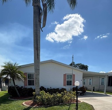 Welcome home to this beautifully maintained 3-bedroom, 2-bath on Sabal Springs Golf and Racquet Club in Florida - for sale on GolfHomes.com, golf home, golf lot