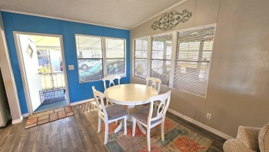 Welcome to paradise in this stunning 2-bedroom, 2-bathroom home on Blue Heron Pines Golf Course in Florida - for sale on GolfHomes.com, golf home, golf lot