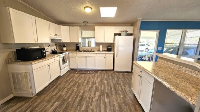 Welcome to paradise in this stunning 2-bedroom, 2-bathroom home on Blue Heron Pines Golf Course in Florida - for sale on GolfHomes.com, golf home, golf lot