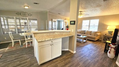 Welcome to paradise in this stunning 2-bedroom, 2-bathroom home on Blue Heron Pines Golf Course in Florida - for sale on GolfHomes.com, golf home, golf lot