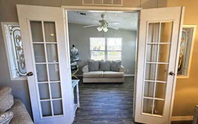 Welcome to paradise in this stunning 2-bedroom, 2-bathroom home on Blue Heron Pines Golf Course in Florida - for sale on GolfHomes.com, golf home, golf lot