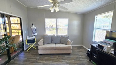 Welcome to paradise in this stunning 2-bedroom, 2-bathroom home on Blue Heron Pines Golf Course in Florida - for sale on GolfHomes.com, golf home, golf lot