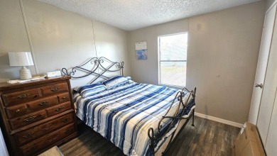 Welcome to paradise in this stunning 2-bedroom, 2-bathroom home on Blue Heron Pines Golf Course in Florida - for sale on GolfHomes.com, golf home, golf lot