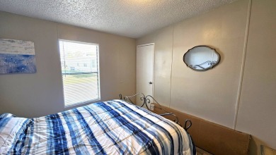 Welcome to paradise in this stunning 2-bedroom, 2-bathroom home on Blue Heron Pines Golf Course in Florida - for sale on GolfHomes.com, golf home, golf lot