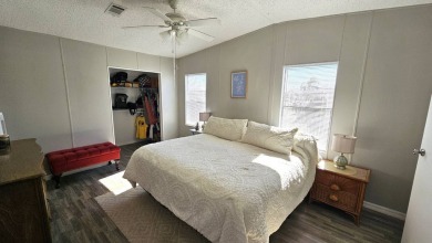 Welcome to paradise in this stunning 2-bedroom, 2-bathroom home on Blue Heron Pines Golf Course in Florida - for sale on GolfHomes.com, golf home, golf lot