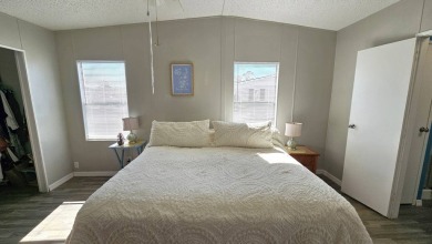 Welcome to paradise in this stunning 2-bedroom, 2-bathroom home on Blue Heron Pines Golf Course in Florida - for sale on GolfHomes.com, golf home, golf lot