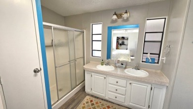 Welcome to paradise in this stunning 2-bedroom, 2-bathroom home on Blue Heron Pines Golf Course in Florida - for sale on GolfHomes.com, golf home, golf lot