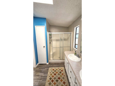 Welcome to paradise in this stunning 2-bedroom, 2-bathroom home on Blue Heron Pines Golf Course in Florida - for sale on GolfHomes.com, golf home, golf lot