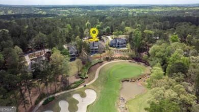Indulge in opulent living within this custom 5-bedroom, 5.5-bath on Reynolds Lake Oconee - The Oconee in Georgia - for sale on GolfHomes.com, golf home, golf lot