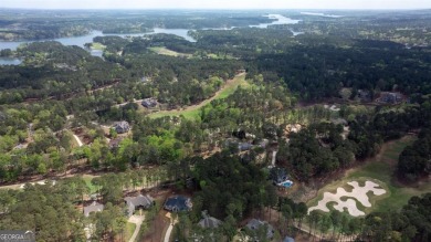 Indulge in opulent living within this custom 5-bedroom, 5.5-bath on Reynolds Lake Oconee - The Oconee in Georgia - for sale on GolfHomes.com, golf home, golf lot