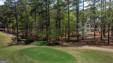 Indulge in opulent living within this custom 5-bedroom, 5.5-bath on Reynolds Lake Oconee - The Oconee in Georgia - for sale on GolfHomes.com, golf home, golf lot