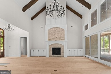 Indulge in opulent living within this custom 5-bedroom, 5.5-bath on Reynolds Lake Oconee - The Oconee in Georgia - for sale on GolfHomes.com, golf home, golf lot