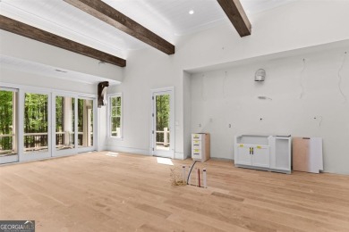 Indulge in opulent living within this custom 5-bedroom, 5.5-bath on Reynolds Lake Oconee - The Oconee in Georgia - for sale on GolfHomes.com, golf home, golf lot
