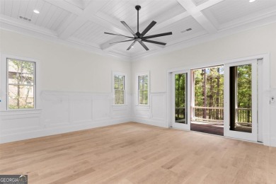 Indulge in opulent living within this custom 5-bedroom, 5.5-bath on Reynolds Lake Oconee - The Oconee in Georgia - for sale on GolfHomes.com, golf home, golf lot