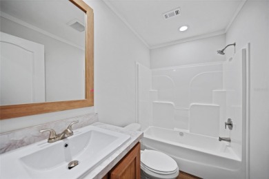 Cute as a button!!! This brand new home not is NOT in a flood on Bobcat Trail Golf Club in Florida - for sale on GolfHomes.com, golf home, golf lot