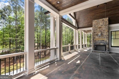 Indulge in opulent living within this custom 5-bedroom, 5.5-bath on Reynolds Lake Oconee - The Oconee in Georgia - for sale on GolfHomes.com, golf home, golf lot