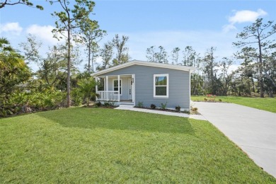 Cute as a button!!! This brand new home not is NOT in a flood on Bobcat Trail Golf Club in Florida - for sale on GolfHomes.com, golf home, golf lot