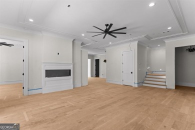Indulge in opulent living within this custom 5-bedroom, 5.5-bath on Reynolds Lake Oconee - The Oconee in Georgia - for sale on GolfHomes.com, golf home, golf lot