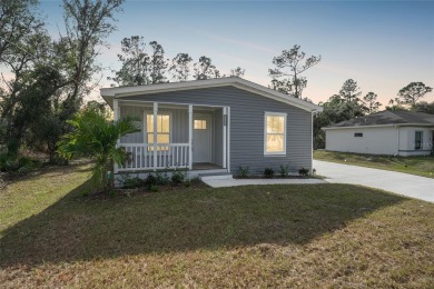 Cute as a button!!! This brand new home not is NOT in a flood on Bobcat Trail Golf Club in Florida - for sale on GolfHomes.com, golf home, golf lot