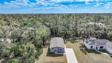 Cute as a button!!! This brand new home not is NOT in a flood on Bobcat Trail Golf Club in Florida - for sale on GolfHomes.com, golf home, golf lot
